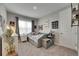 Comfortable bedroom with a modern bed, space-themed decorations, and lots of natural light at 10399 Boyette Brook St, Riverview, FL 33569
