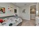 Neutral colored bedroom with space themed decor and adjacent walk-in closet at 10399 Boyette Brook St, Riverview, FL 33569
