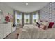Bright bedroom with a large window and plush pillows, creating a relaxing space at 10399 Boyette Brook St, Riverview, FL 33569