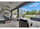 Inviting covered patio features comfortable seating and outdoor kitchen, ideal for relaxing and entertaining at 10399 Boyette Brook St, Riverview, FL 33569