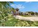 Beautiful two-story house with a large driveway, two car garage, and landscaped lawn at 10399 Boyette Brook St, Riverview, FL 33569