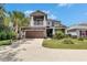 Lovely two-story home with a two car garage, beautiful landscaping, and covered porch at 10399 Boyette Brook St, Riverview, FL 33569