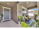 Cozy front porch featuring rocking chairs, stylish decor, and a welcoming entrance at 10399 Boyette Brook St, Riverview, FL 33569