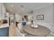 Modern kitchen with an island and breakfast nook that leads to the home's staircase at 10399 Boyette Brook St, Riverview, FL 33569