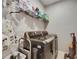 Laundry room with modern appliances and ample shelving for storage and convenience at 10399 Boyette Brook St, Riverview, FL 33569