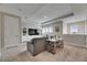 Cozy living room with sofa, table, large TV and neutral colored walls at 10399 Boyette Brook St, Riverview, FL 33569