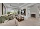 Comfortable living room featuring a decorative TV console, neutral color palette, and plenty of natural light at 10399 Boyette Brook St, Riverview, FL 33569