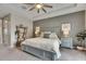Main bedroom with a king bed, bedside tables, lamps, and decorative ladder shelf at 10399 Boyette Brook St, Riverview, FL 33569
