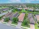 A stunning aerial view of a residential neighborhood with mature trees and lush landscaping at 10450 Highland Park Pl, Palmetto, FL 34221