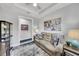 Bonus room with artwork, recessed lights, neutral walls and a comfortable couch at 10450 Highland Park Pl, Palmetto, FL 34221