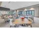Elegant dining room featuring stylish tables, chairs, and natural lighting at 10450 Highland Park Pl, Palmetto, FL 34221