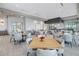 Stylish clubhouse with dining area, tables, chairs, and access to a kitchen at 10450 Highland Park Pl, Palmetto, FL 34221