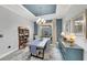 Elegant dining room with modern furnishings, stylish decor, and a tray ceiling at 10450 Highland Park Pl, Palmetto, FL 34221