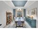 Elegant dining room with modern furnishings, stylish decor, and a tray ceiling at 10450 Highland Park Pl, Palmetto, FL 34221