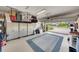 Organized garage with ample storage cabinets and overhead racks at 10450 Highland Park Pl, Palmetto, FL 34221