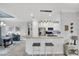 Bright kitchen with stainless appliances, white cabinets, and a breakfast bar for casual dining at 10450 Highland Park Pl, Palmetto, FL 34221