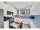 Bright kitchen features stainless steel appliances, white cabinets, and granite countertops at 10450 Highland Park Pl, Palmetto, FL 34221