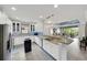 Bright kitchen features stainless steel appliances, white cabinets, and granite countertops at 10450 Highland Park Pl, Palmetto, FL 34221