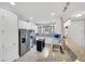 Bright kitchen features stainless steel appliances, white cabinets, and granite countertops at 10450 Highland Park Pl, Palmetto, FL 34221