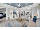 Comfortable living room features an open layout with views into the kitchen and another bedroom at 10450 Highland Park Pl, Palmetto, FL 34221