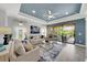 Comfortable living room featuring access to the patio and well-lit interior at 10450 Highland Park Pl, Palmetto, FL 34221