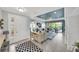 Inviting living room that flows from the front door with access to the patio and ample seating space at 10450 Highland Park Pl, Palmetto, FL 34221