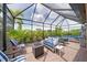 Covered patio showcases hot tub, fire pit and outdoor seating with lovely views at 10450 Highland Park Pl, Palmetto, FL 34221