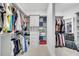 Spacious walk-in closet featuring custom shelving, ample storage, and well-organized layout at 10450 Highland Park Pl, Palmetto, FL 34221