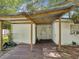 Covered back porch with wooden decking, corrugated metal roof, and view of the backyard at 111 E Early St, Brooksville, FL 34601