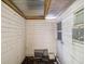 Enclosed back porch featuring an air conditioner and some storage area at 111 E Early St, Brooksville, FL 34601