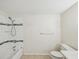 The tiled bathroom features a shower-tub combination and a toilet at 111 E Early St, Brooksville, FL 34601