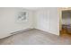 This carpeted bedroom includes a window for natural light and a closet for storage at 111 E Early St, Brooksville, FL 34601