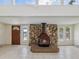 Cozy living room with a stone fireplace and high ceilings for natural light at 111 E Early St, Brooksville, FL 34601