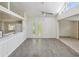 Bright, open living room featuring gray floors and unique windows for natural light at 111 E Early St, Brooksville, FL 34601