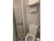 Efficient bathroom with shower stall, toilet, tile flooring, and a towel rack for convenience at 12133 Spartan Way # 203, Hudson, FL 34667