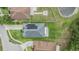 An aerial view of a residence with solar panels, landscaping, and well-maintained lawns at 12251 Duckett Ct, Spring Hill, FL 34610