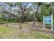 Deerfield Lakes community entrance with natural surroundings, including trees and greenery at 12251 Duckett Ct, Spring Hill, FL 34610