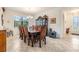 Dining room with traditional decor, showcasing a large wooden table and china cabinet at 12251 Duckett Ct, Spring Hill, FL 34610