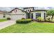 Attractive home with a two-car garage, neat landscaping, and a welcoming front entrance exuding curb appeal at 12251 Duckett Ct, Spring Hill, FL 34610