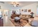 Inviting living room with an open layout, tile flooring, and comfortable furnishings at 12251 Duckett Ct, Spring Hill, FL 34610