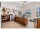 Bright office with large desk, plush carpet, and window bringing in lots of light at 12251 Duckett Ct, Spring Hill, FL 34610