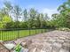 A spacious back deck with a seating area, and overlooks lush green grass at 12603 Corral Rd, Tampa, FL 33626