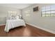 Cozy bedroom with hardwood floors, natural light, and a closet at 12603 Corral Rd, Tampa, FL 33626