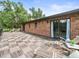 Outdoor deck with wood tile, iron railings, and access to the home's interior at 12603 Corral Rd, Tampa, FL 33626