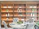 Dining table, decorative shelving with lighting and decor at 12603 Corral Rd, Tampa, FL 33626