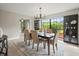 Elegant dining room featuring a large window with backyard views and stylish decor at 12603 Corral Rd, Tampa, FL 33626
