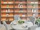 Beautiful dining area with built-in shelving and an elegantly set round table at 12603 Corral Rd, Tampa, FL 33626