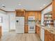 Modern kitchen features granite countertops, wine storage, and stainless-steel appliances at 12603 Corral Rd, Tampa, FL 33626