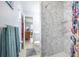 Bathroom with shower stall and view into the Primary bedroom at 12877 Palm Dr, Largo, FL 33774