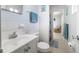 Bathroom featuring a vanity, toilet, and well-lit with fresh white walls at 12877 Palm Dr, Largo, FL 33774